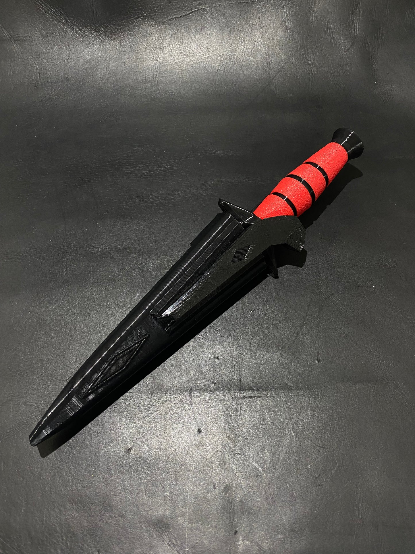 Red marble, black claw, dart knife